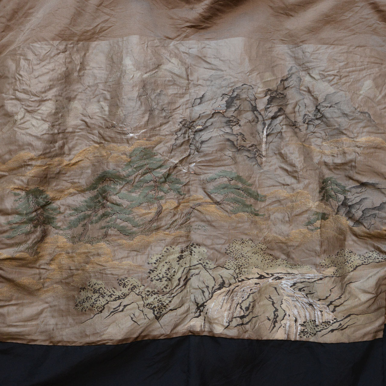 Silk haori lining with mountain, pine, and mist embroidery in gold and green tones