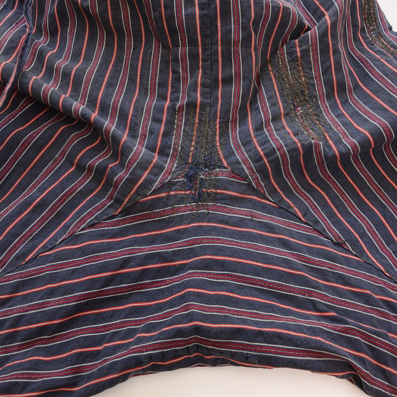 Striped cotton fabric with unique stitched repair details