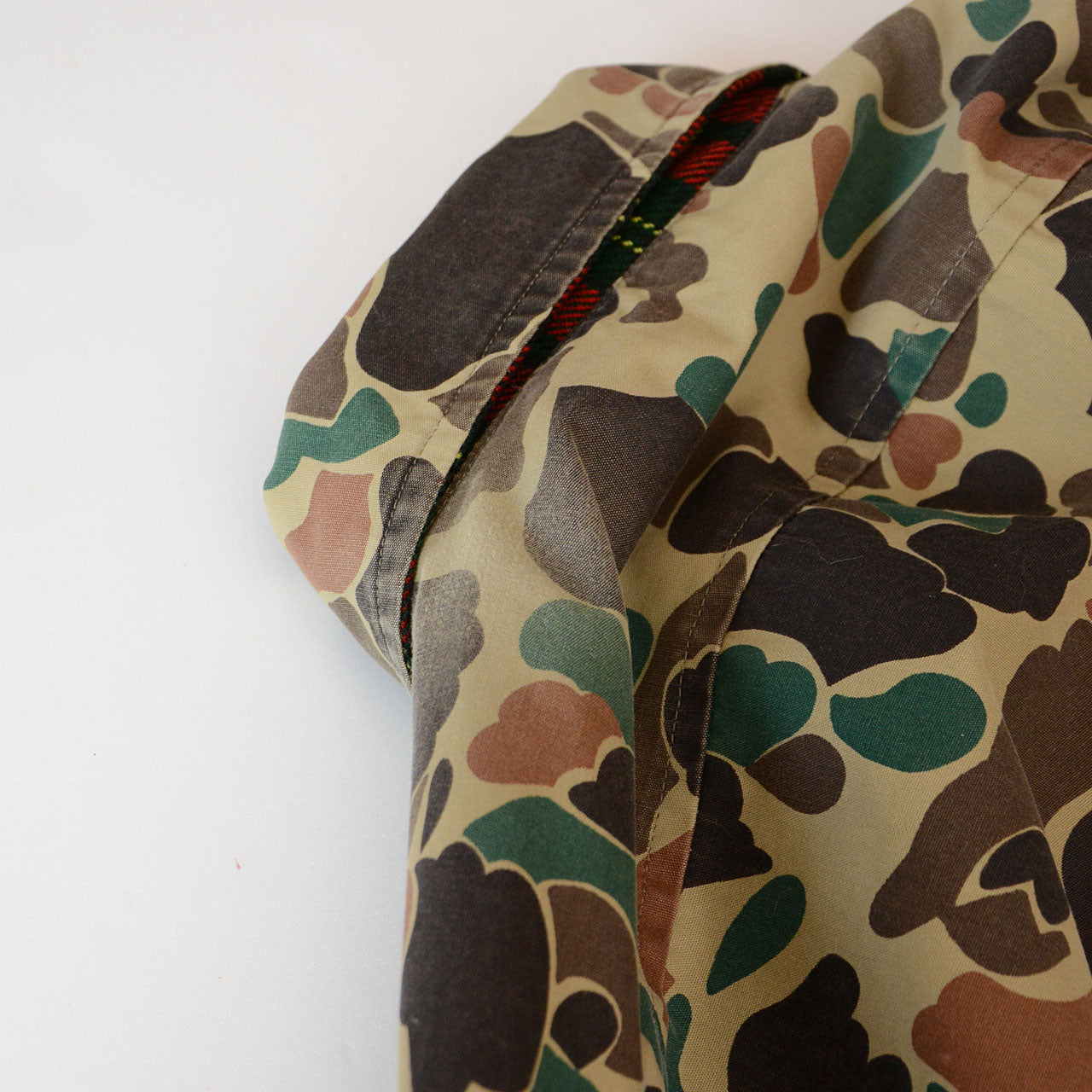 Vintage field jacket with red plaid and camouflage combo