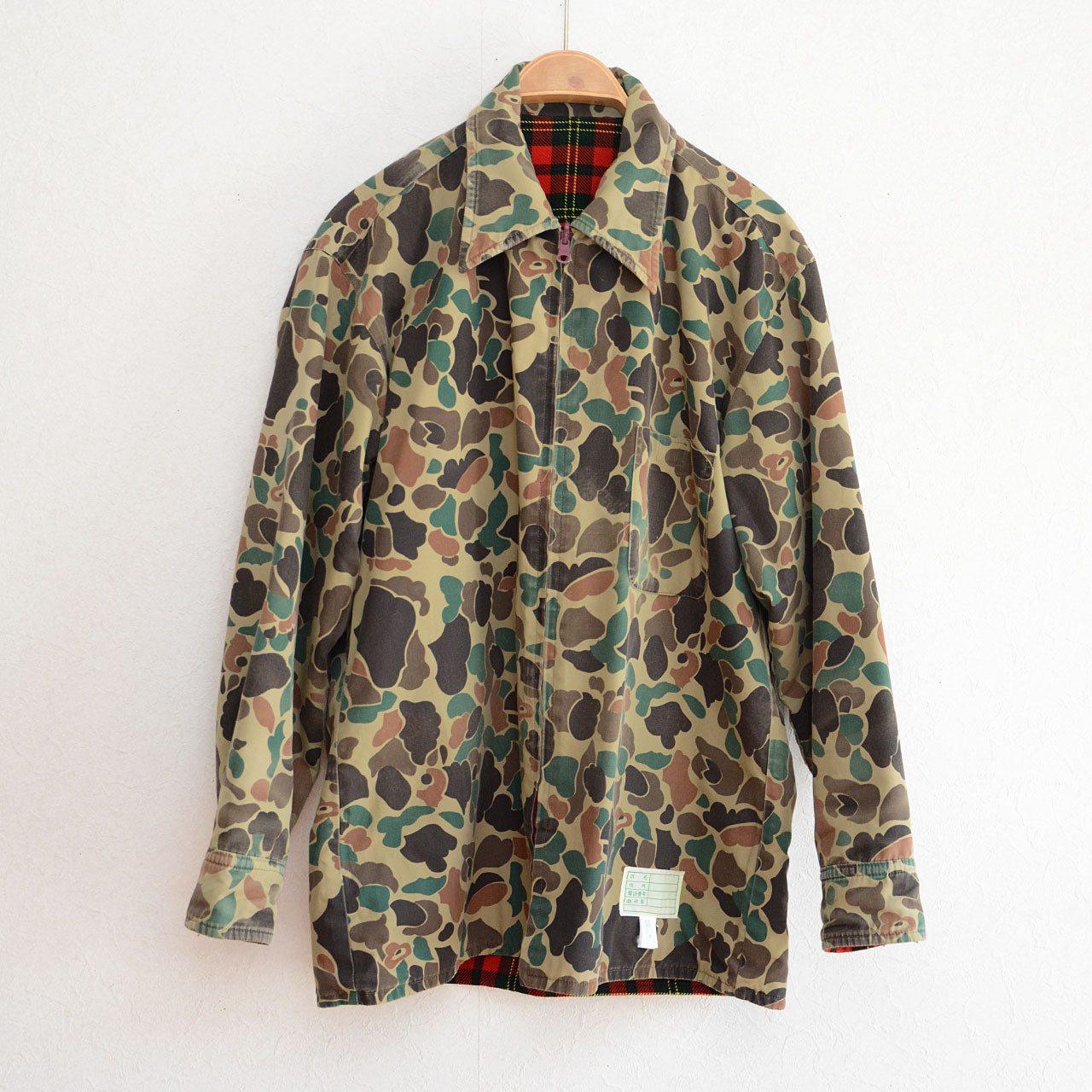 1980s vintage outdoor jacket in red plaid and camouflage pattern