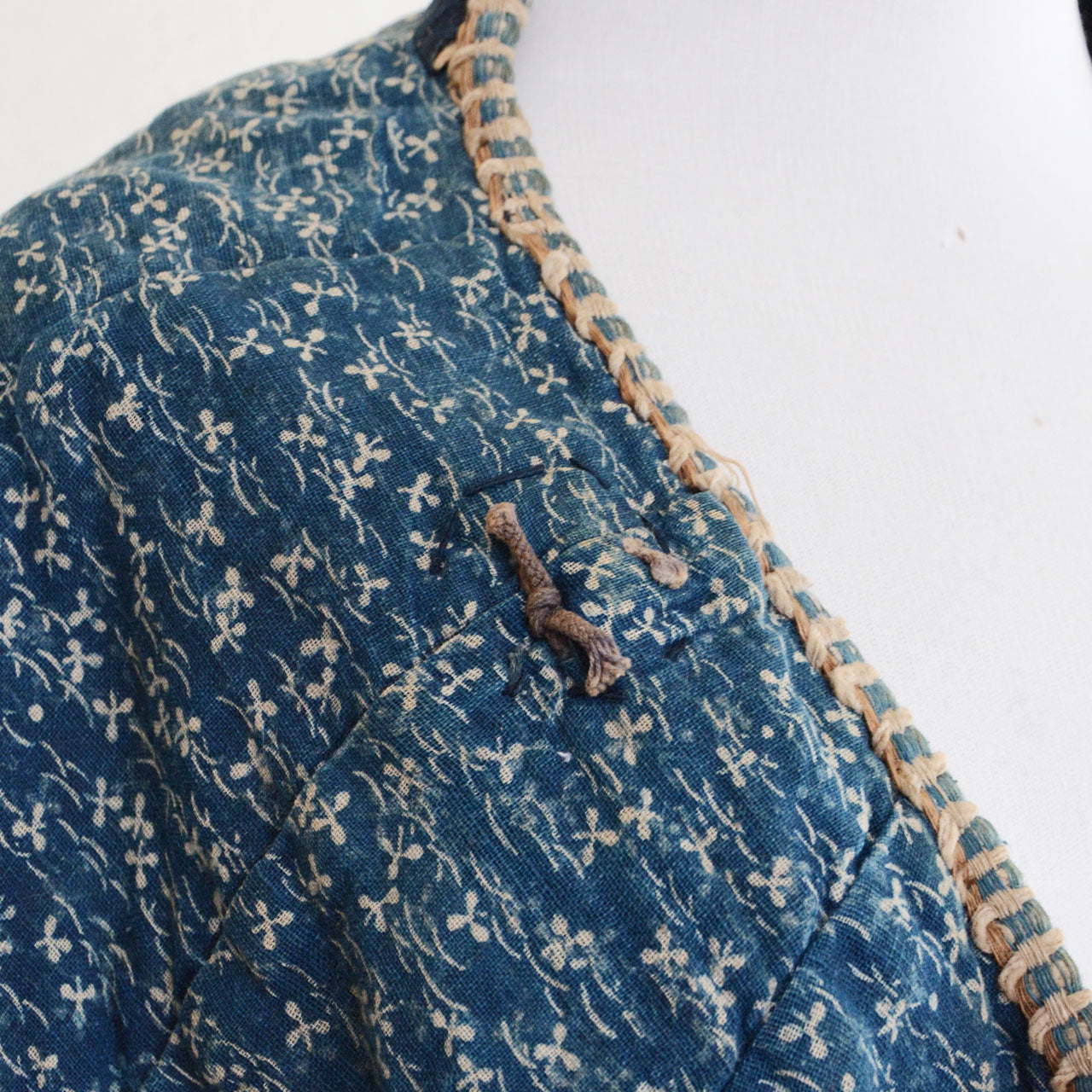 A historical Japanese garment featuring indigo dye and cotton fabric.