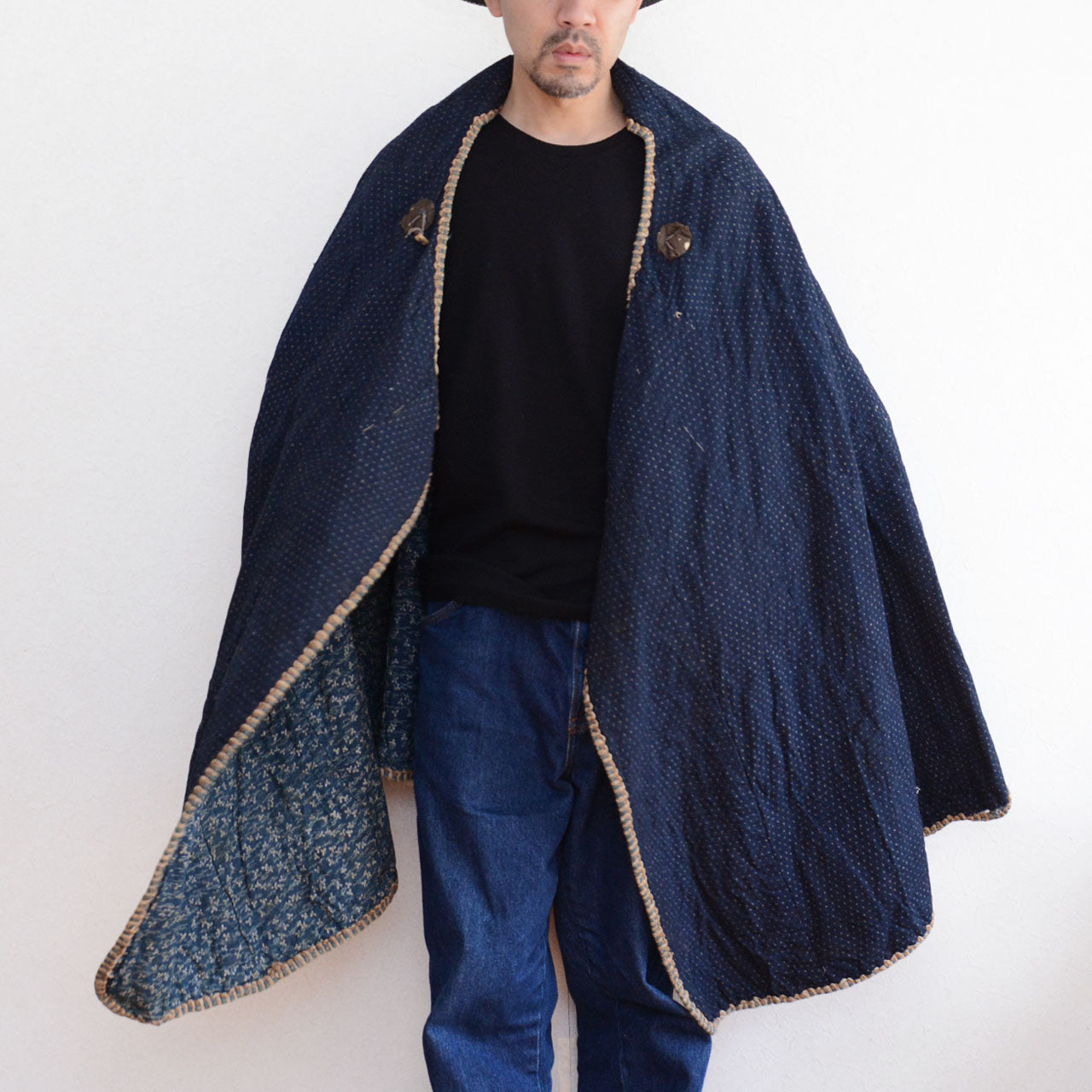 An antique Japanese cotton garment with traditional indigo dyeing.