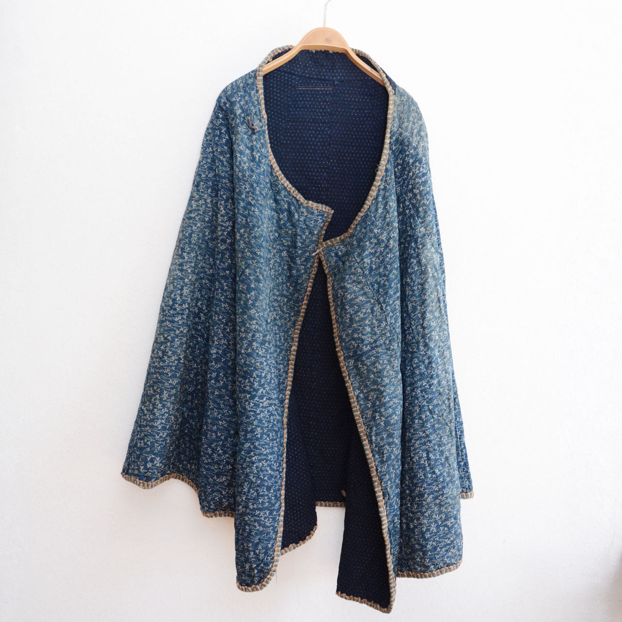 An antique Japanese cotton dochu kappa with traditional indigo dyeing.