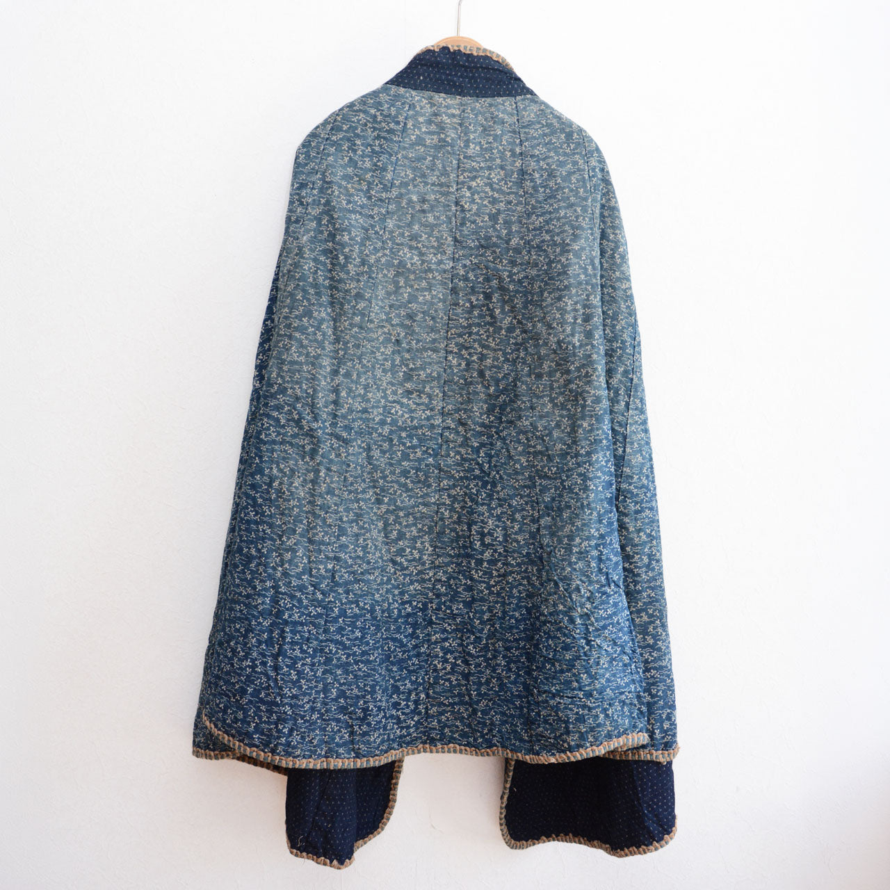 A historical Japanese indigo-dyed dochu kappa travel garment.