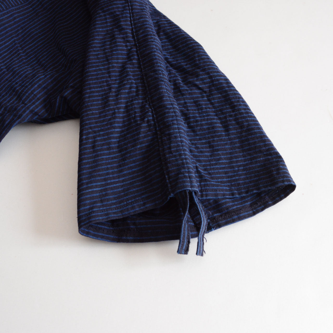 Elegant band collar blouse with unique striped pattern