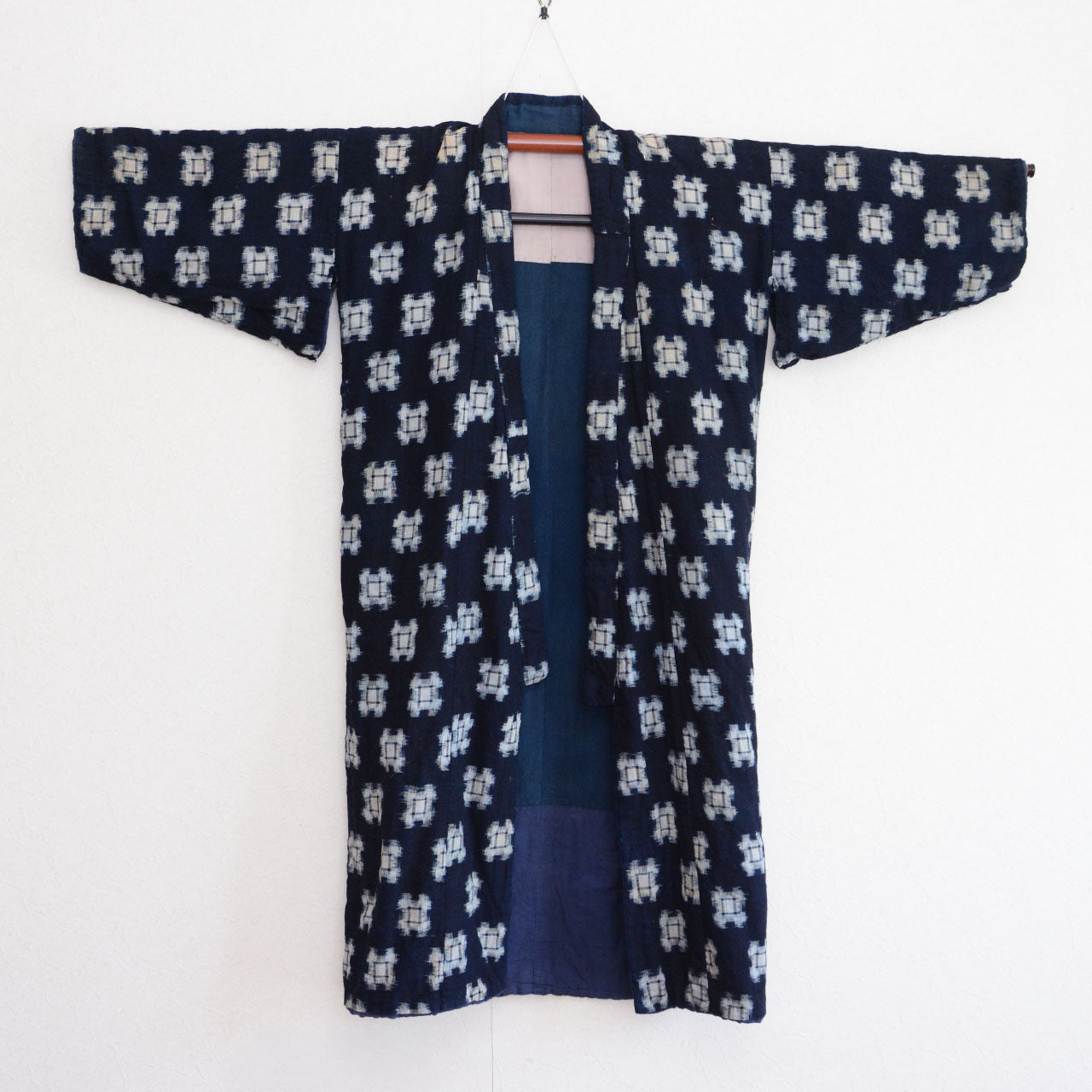 Front side of vintage Japanese hanten padded jacket, flat lay, indigo kasuri outer fabric