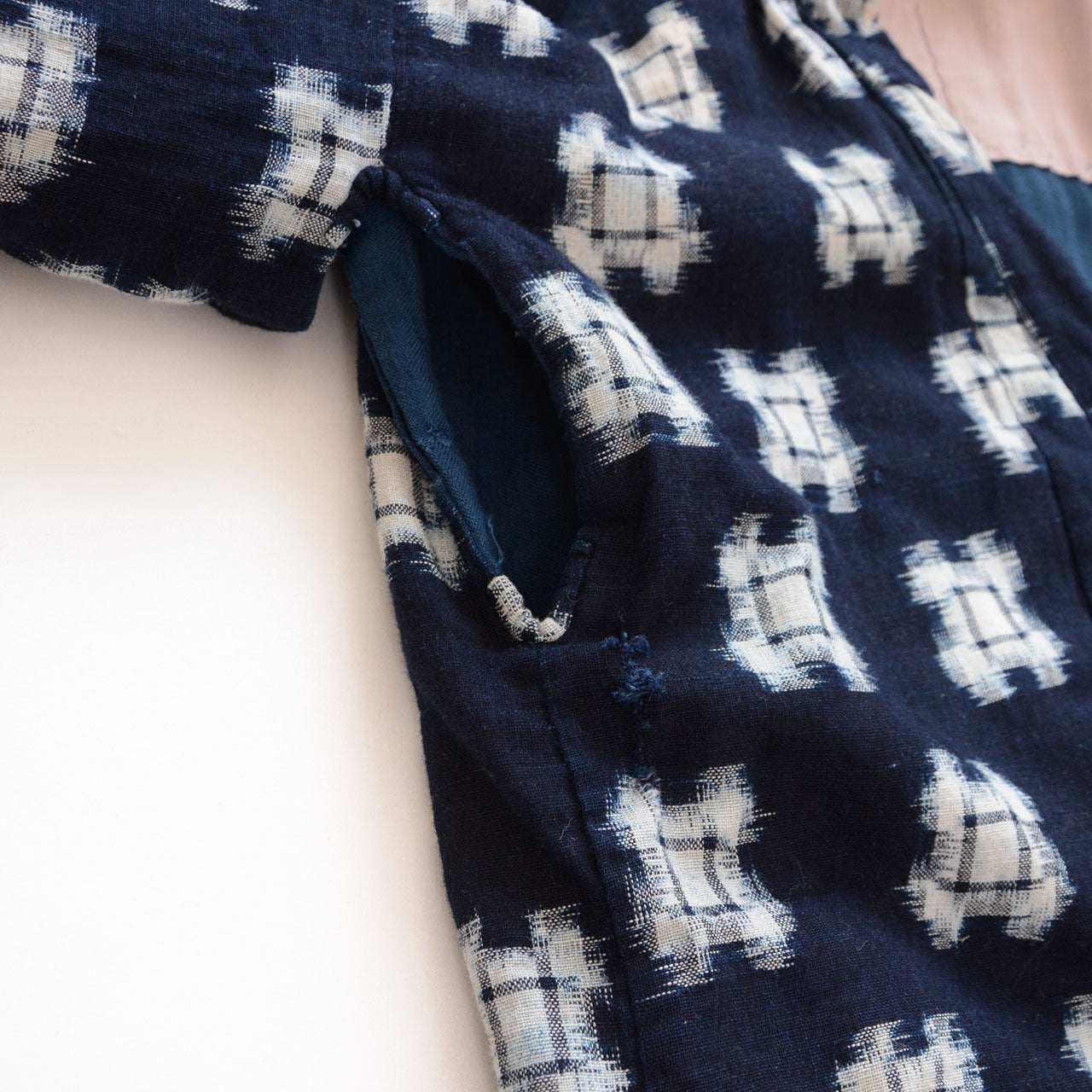 Close-up of sleeve and underarm area showing fraying, vintage hanten padded jacket