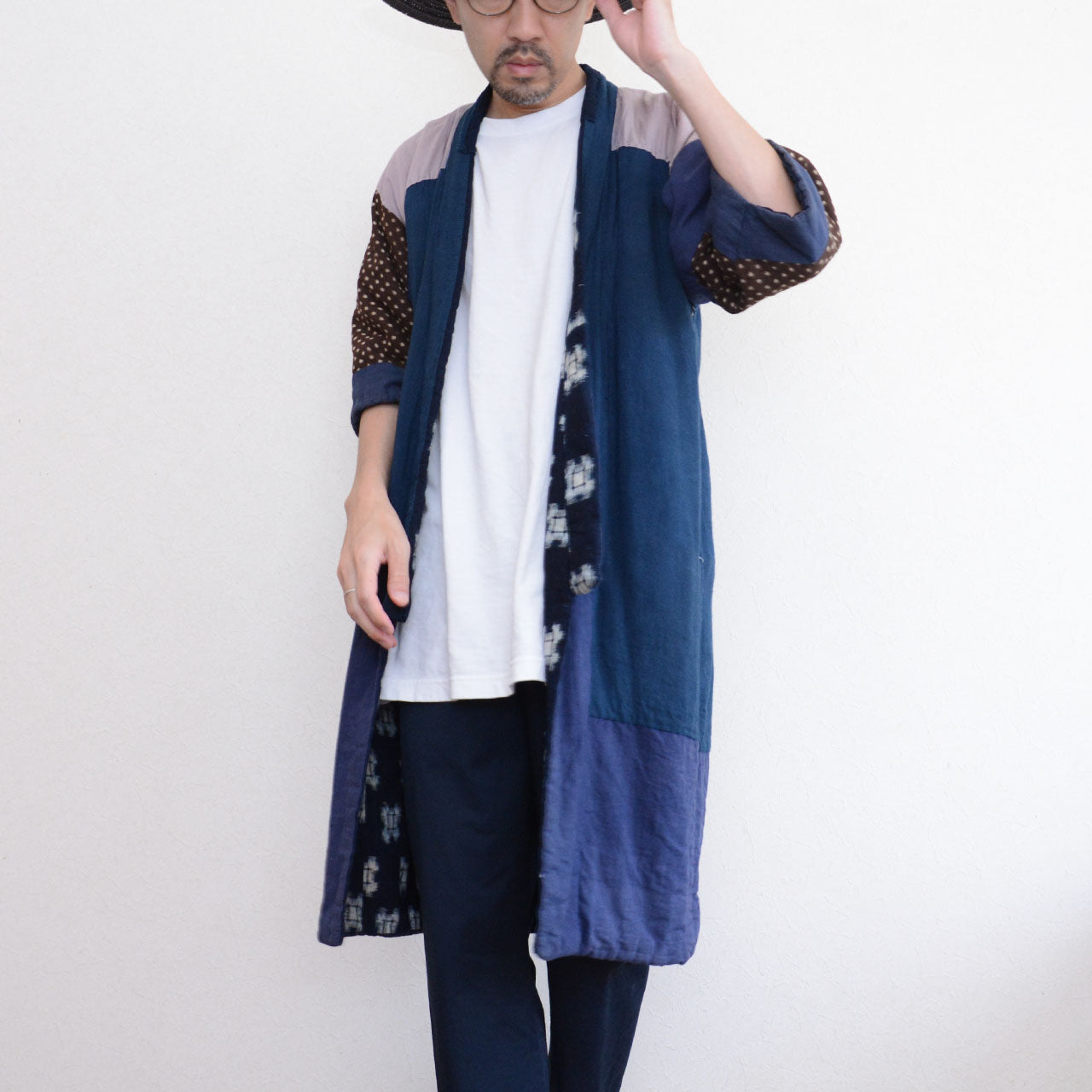 Model wearing vintage Japanese hanten padded jacket open, front view, full length, showing kasuri lining along front placket