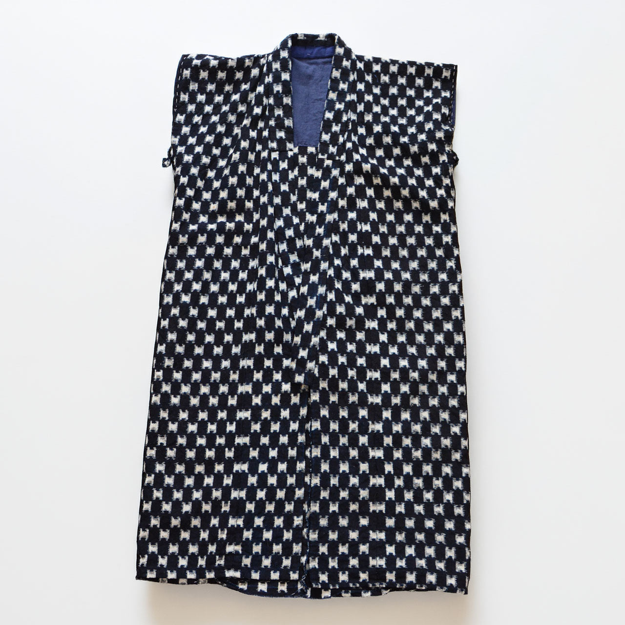 Indigo kasuri cotton haori vest, navy and white ikat weave pattern, front view