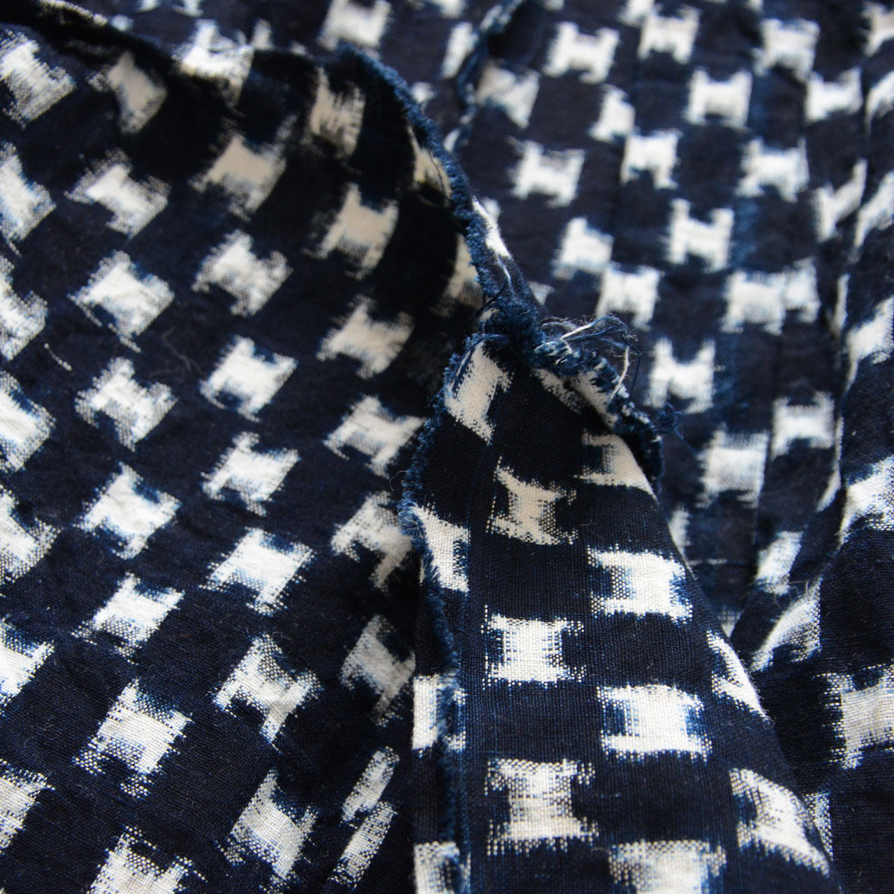 Partial stitching loss along hem, indigo kasuri haori vest condition detail