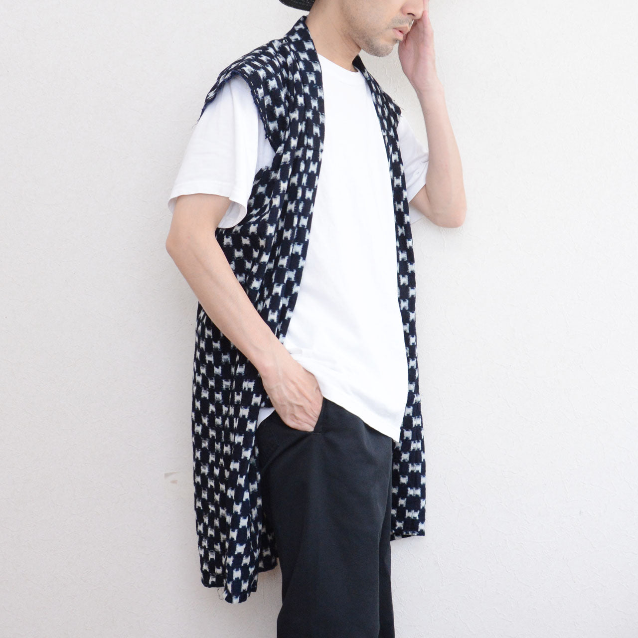 Indigo kasuri sleeveless haori vest styled with white t-shirt and black trousers, front view