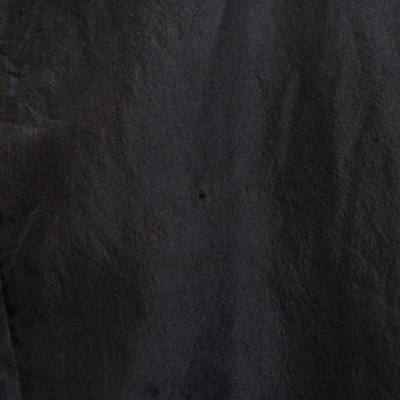 Close-up of haori fabric showing fraying condition detail, black mixed-weave textile, Japan vintage
