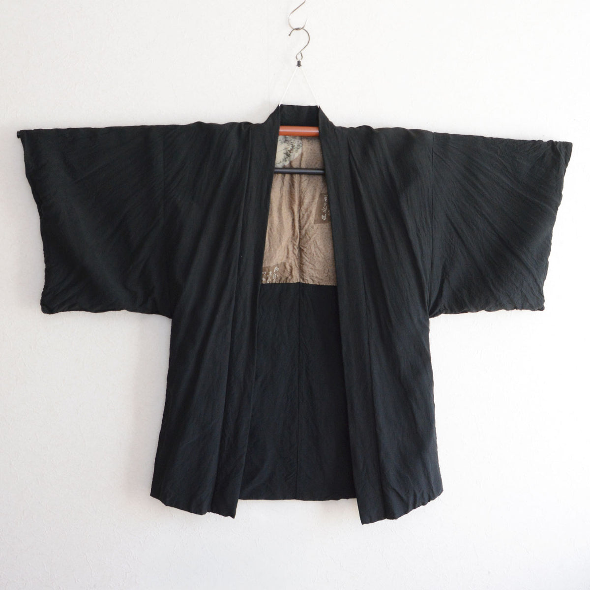 1970s–1980s men's black Japanese vintage haori jacket with wide sleeves and beige patterned lining