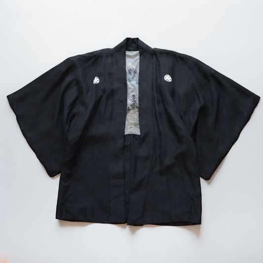 Men's black silk haori jacket with five family crests, laid flat, front view