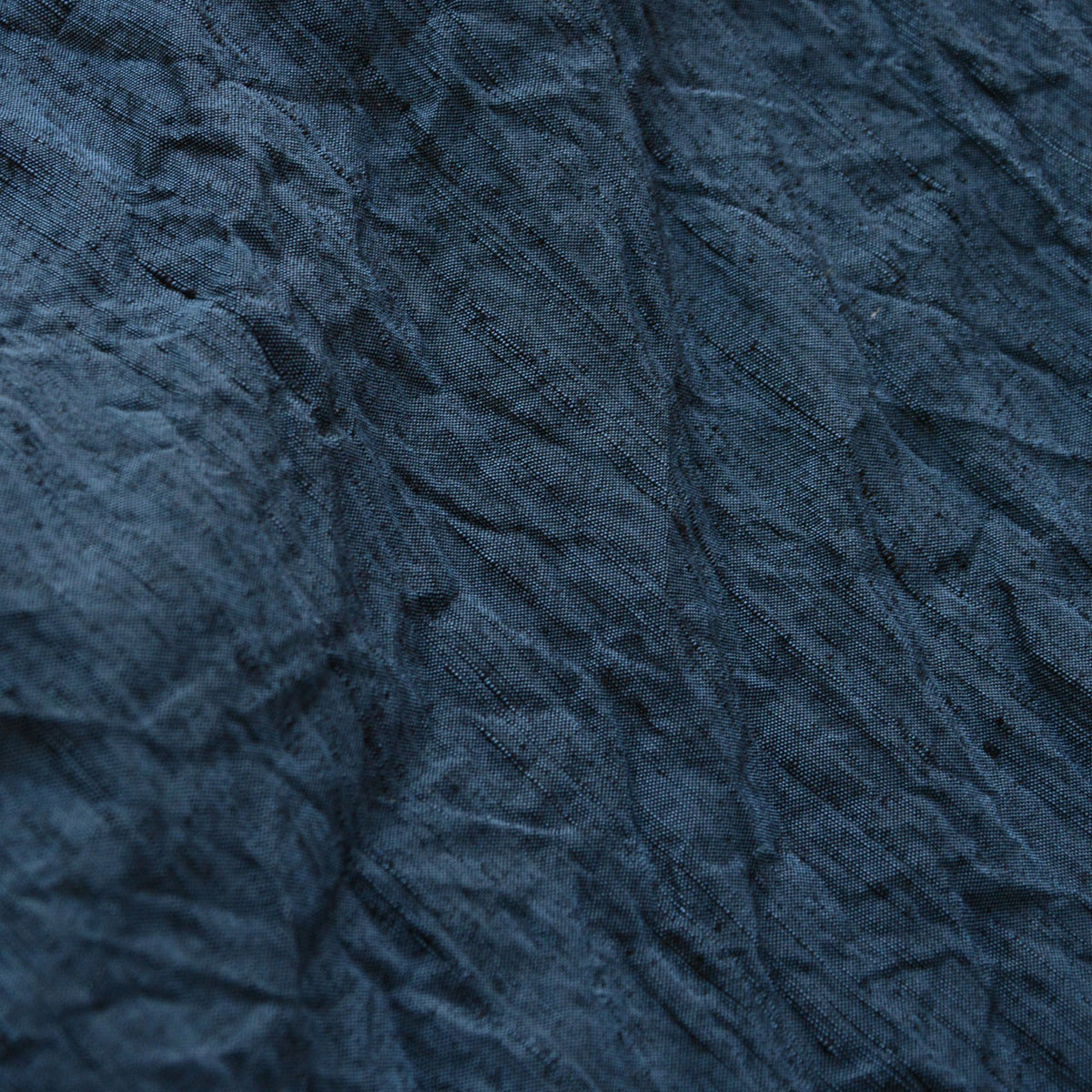Textured blue outer fabric of a men’s Japanese vintage haori jacket, circa 1970s–1980s