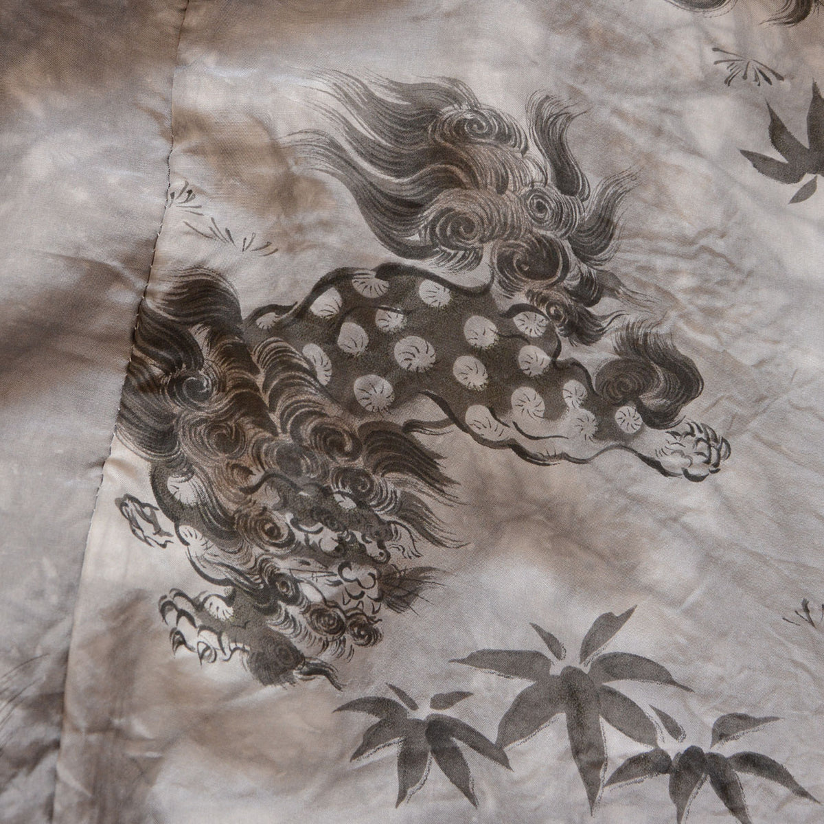 Karajishi lion with a curling mane and bamboo leaf motifs on vintage haori lining