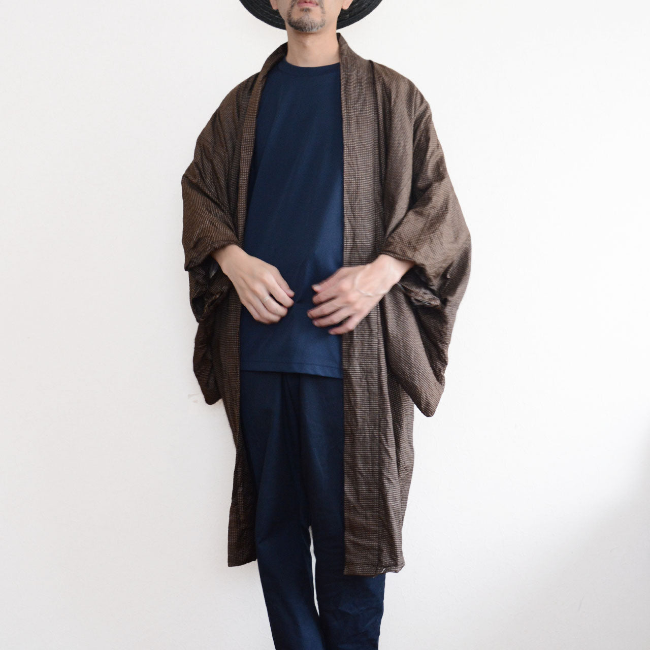 Men's Japanese vintage haori jacket in brown silk komon, front view open style worn over navy t-shirt and trousers, Showa era
