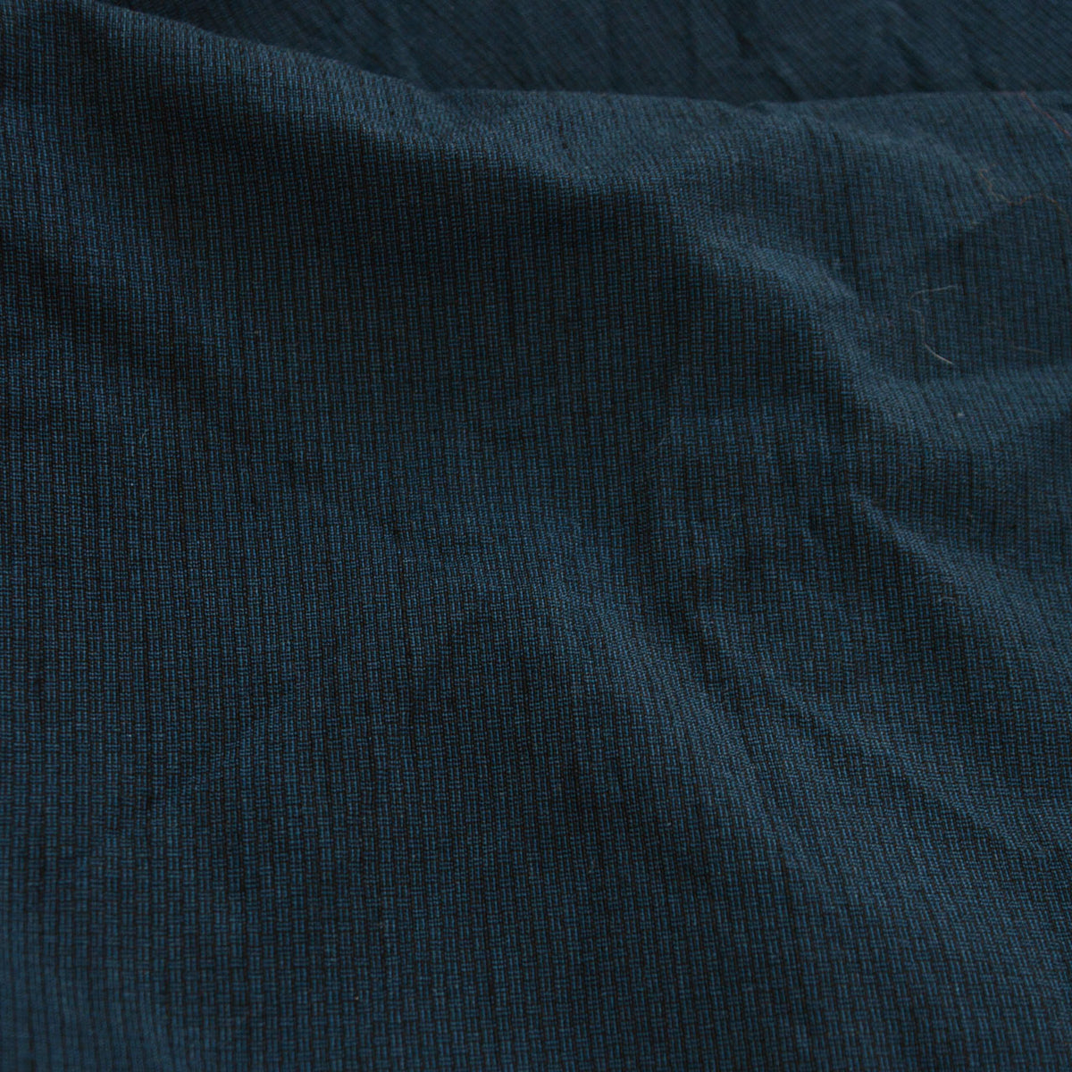 Deep blue-green haori fabric with a subtle woven pattern.