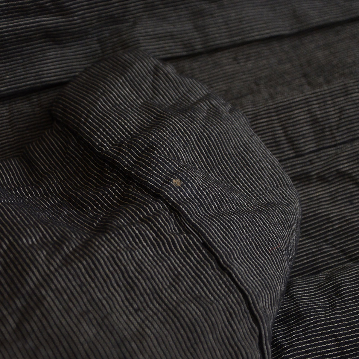 Light-brown mark on the fine-striped fabric of a vintage Japanese haori