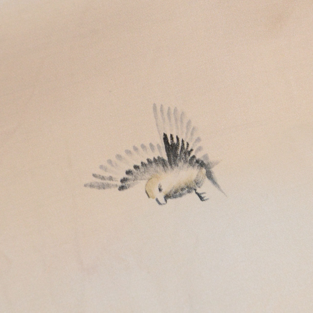 Red square artist's seal on beige haori jacket lining, sumi-e bamboo motif
