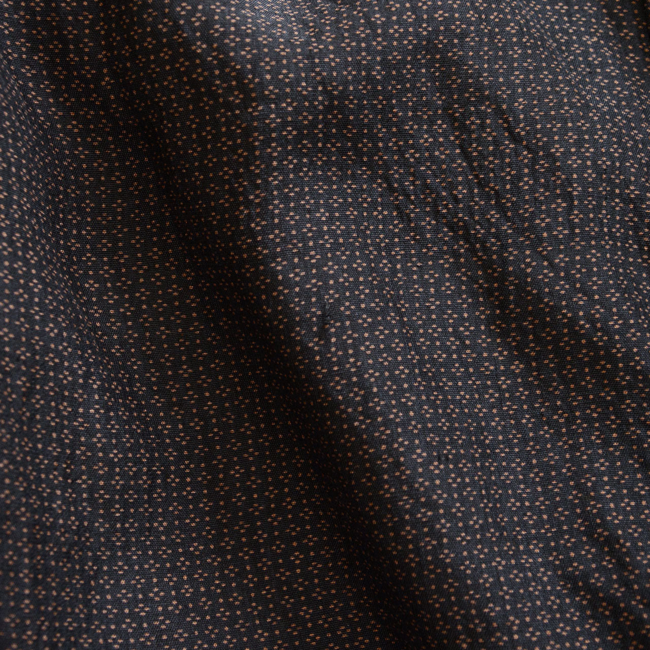 Fraying detail on vintage haori jacket, dark silk blend fabric, aged textile wear, Japan vintage