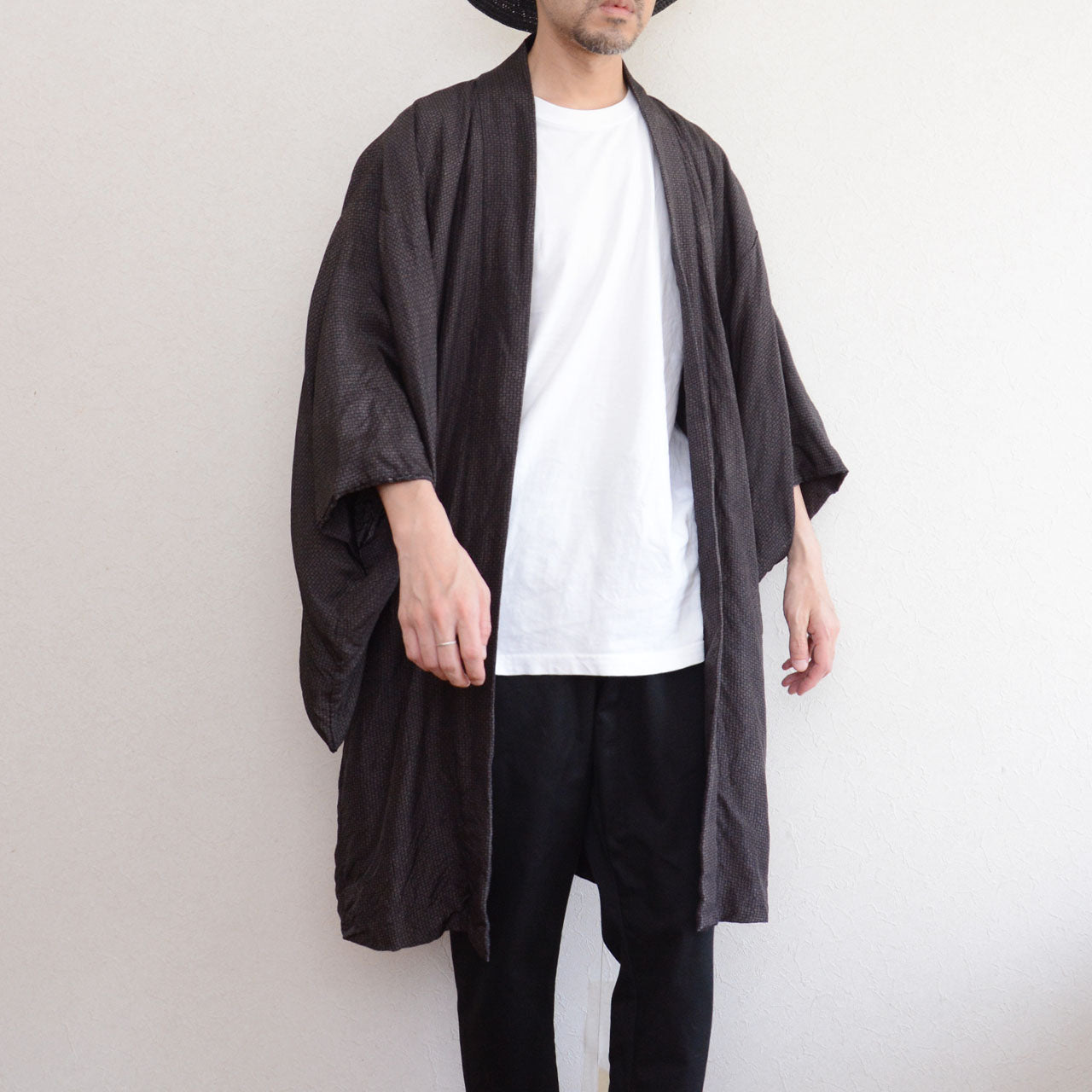 Male model wearing vintage haori jacket, front view, komon pattern, dark silk blend, open front styling, Japan vintage streetwear