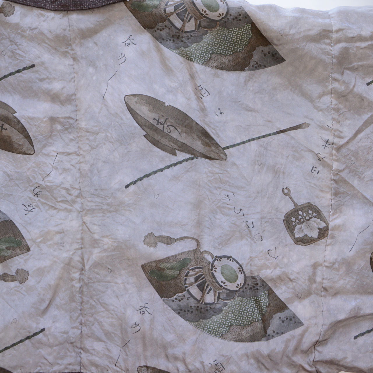 Haori jacket lining — white ground with printed Japanese classical motifs: fan, drum, flute, and Kuroda Bushi folk song lyrics in ink-style calligraphy