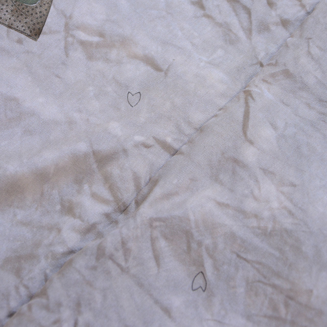 Haori jacket lining detail — white ground with botanical leaf and cherry blossom petal pattern, aged discoloration, vintage Japanese haori jacket