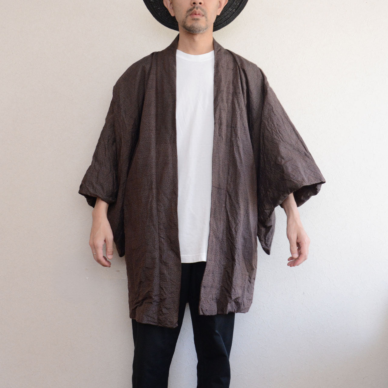 Man wearing a dark brown vintage Japanese haori jacket over a white t-shirt and black jeans — full front view, open silhouette, model height 171cm