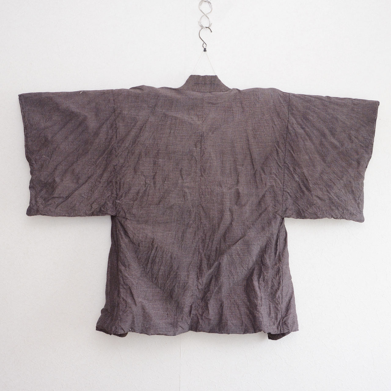 Haori jacket, rayon blend, understated tone outer fabric, on kimono hanger, back view