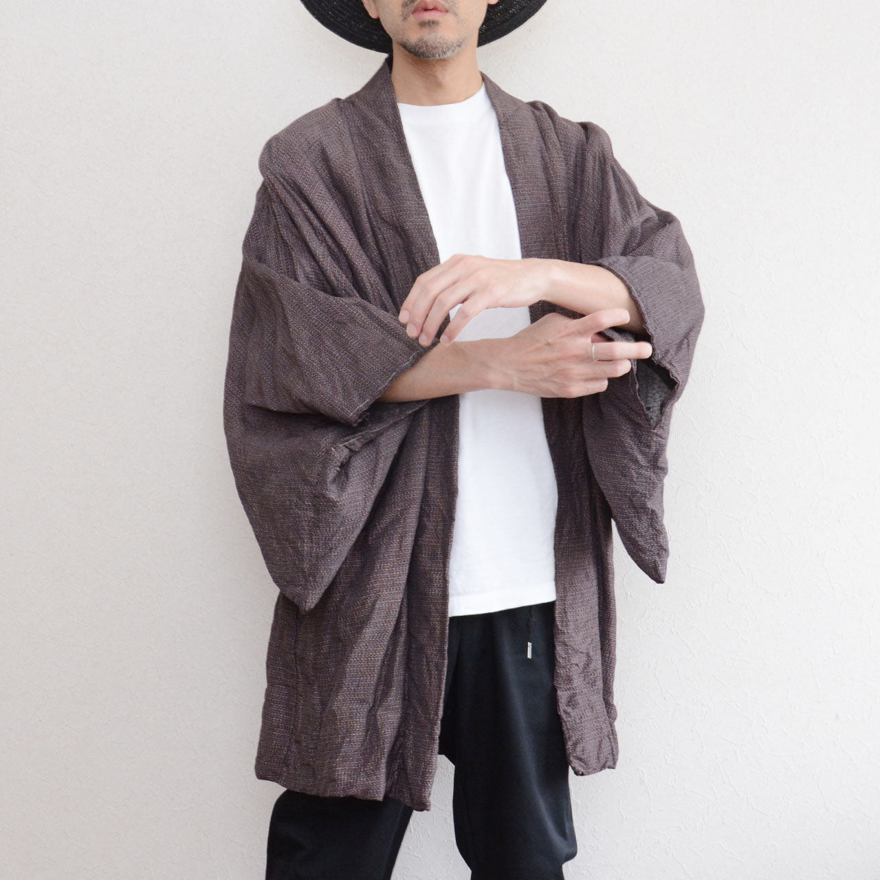 Haori jacket, men's model, front view, arm raised, in motion