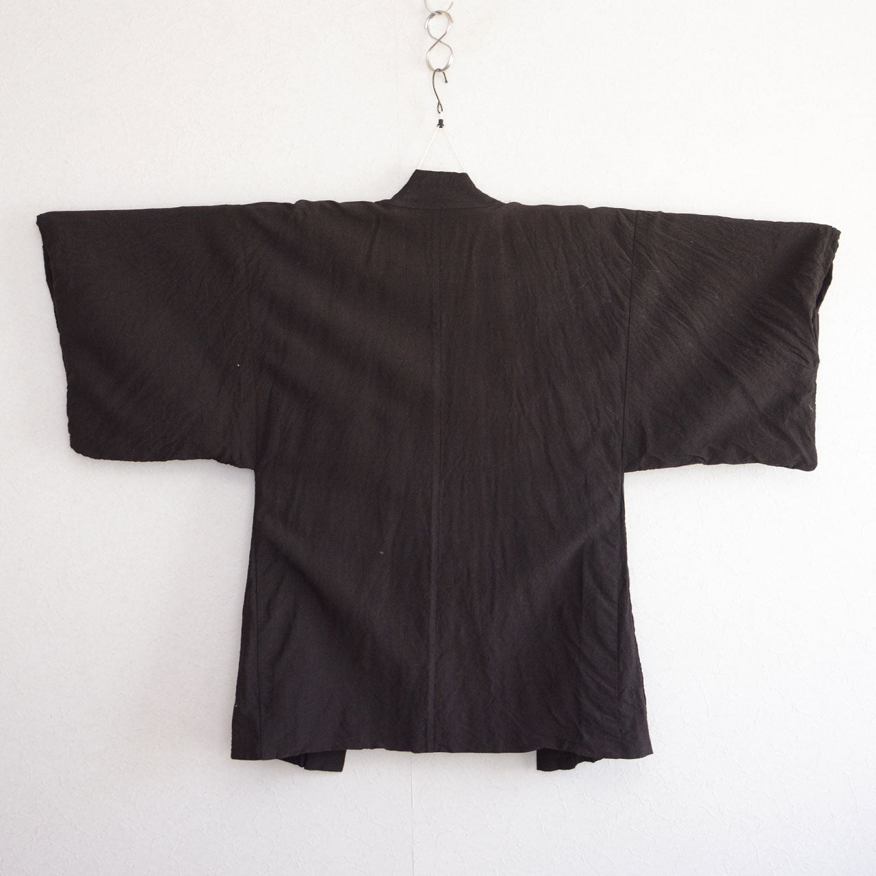 Men's haori jacket, rayon blend, sansui calligraphy lining, Showa era Japan vintage, back view on kimono hanger