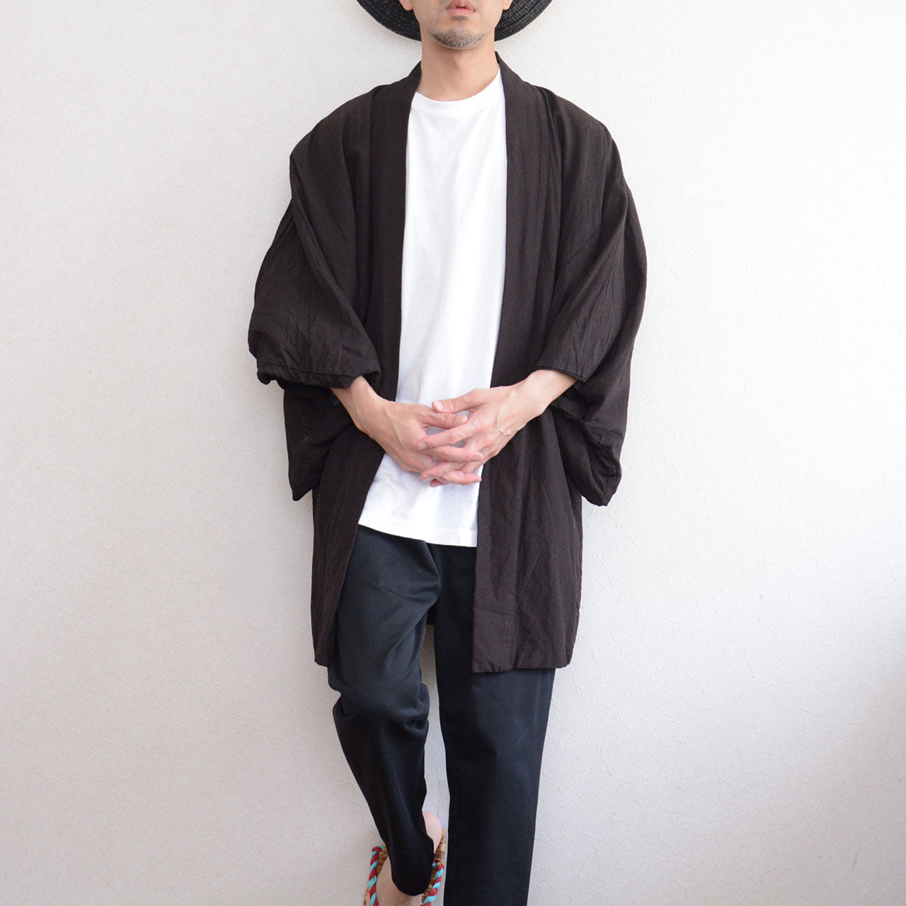 Male model wearing haori jacket over white t-shirt, hands overlapping, front detail, Showa era Japan vintage