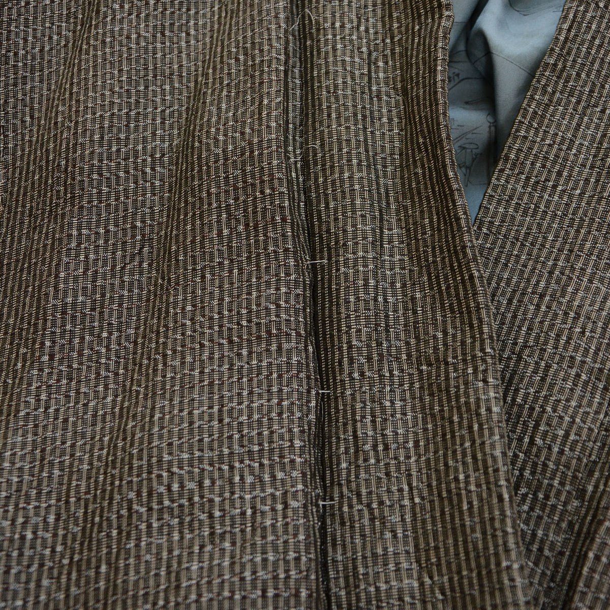 Remaining white basting stitches on a fine-patterned vintage haori jacket