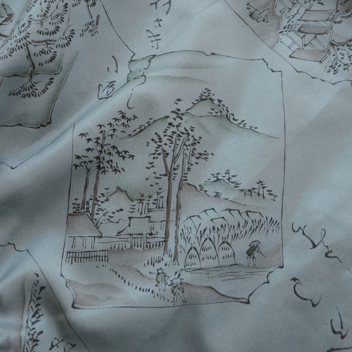 Blue-gray haori lining with mountains, trees, buildings and walking figures