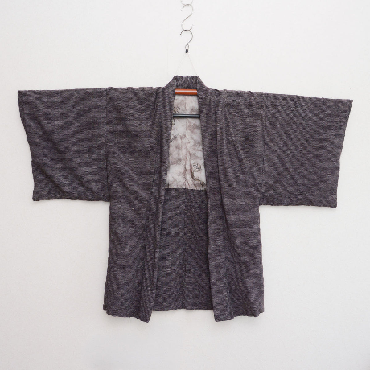Japanese vintage men's haori on a kimono hanger, front view, late Showa era