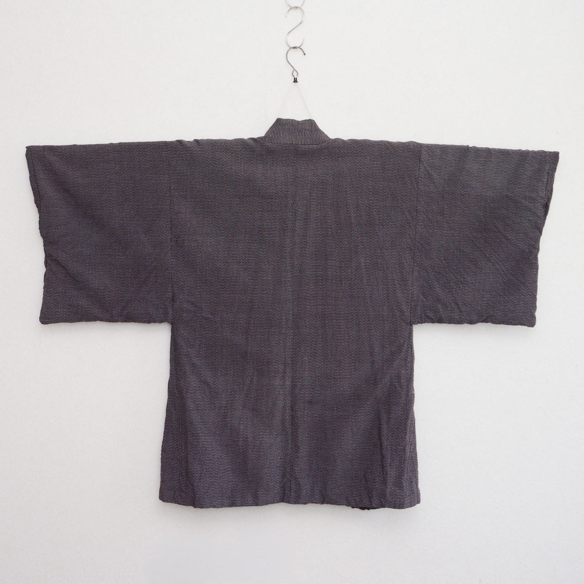 Japanese vintage men's haori on a kimono hanger, back view, late Showa era