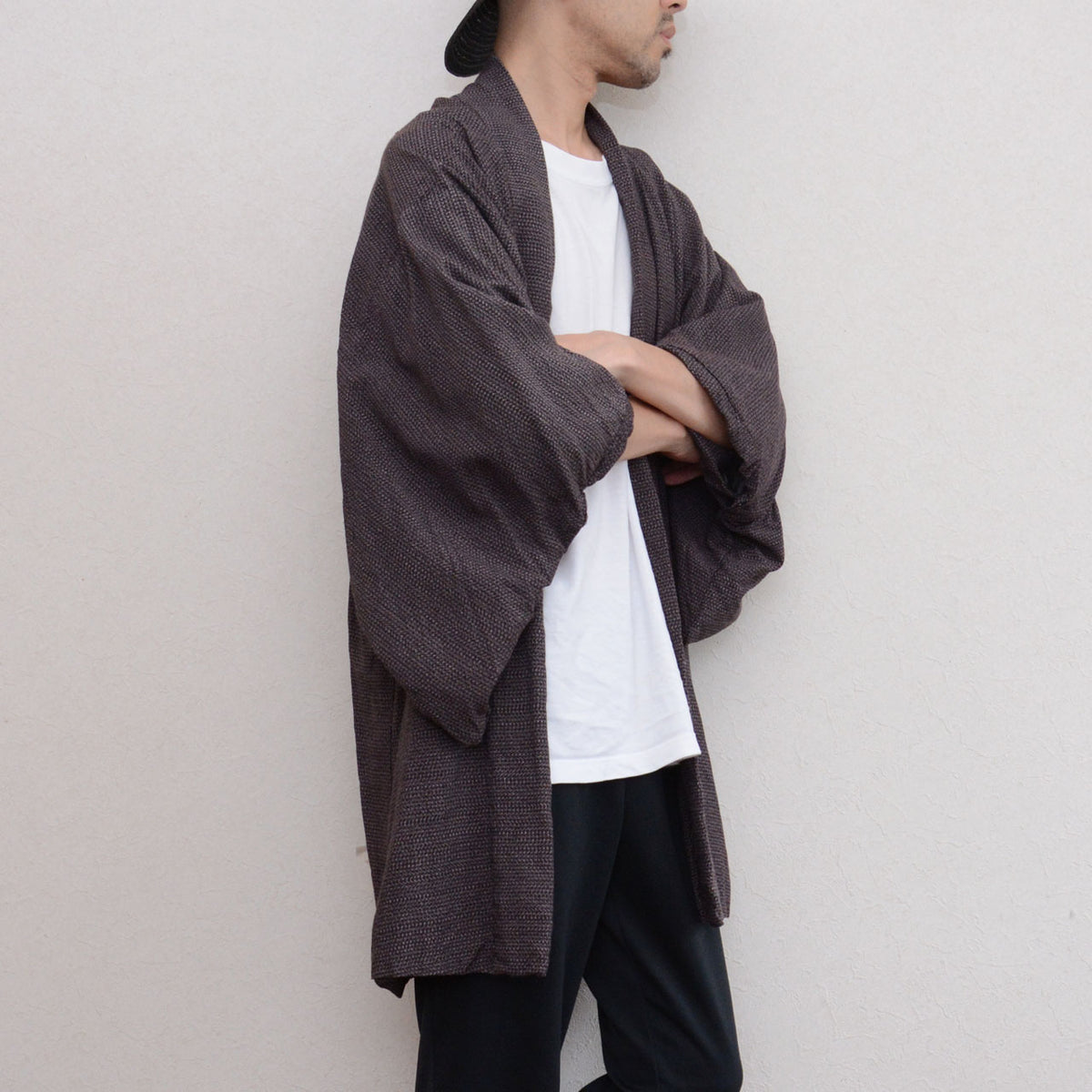 Japanese vintage men's haori worn by a model, arms crossed, late Showa era