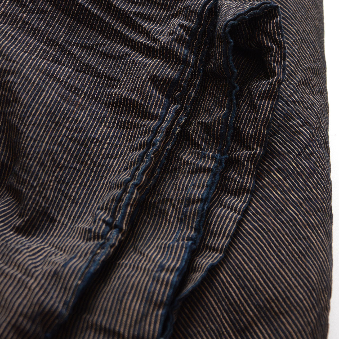 Worn sleeve edge on an indigo striped vintage Japanese cotton haori jacket