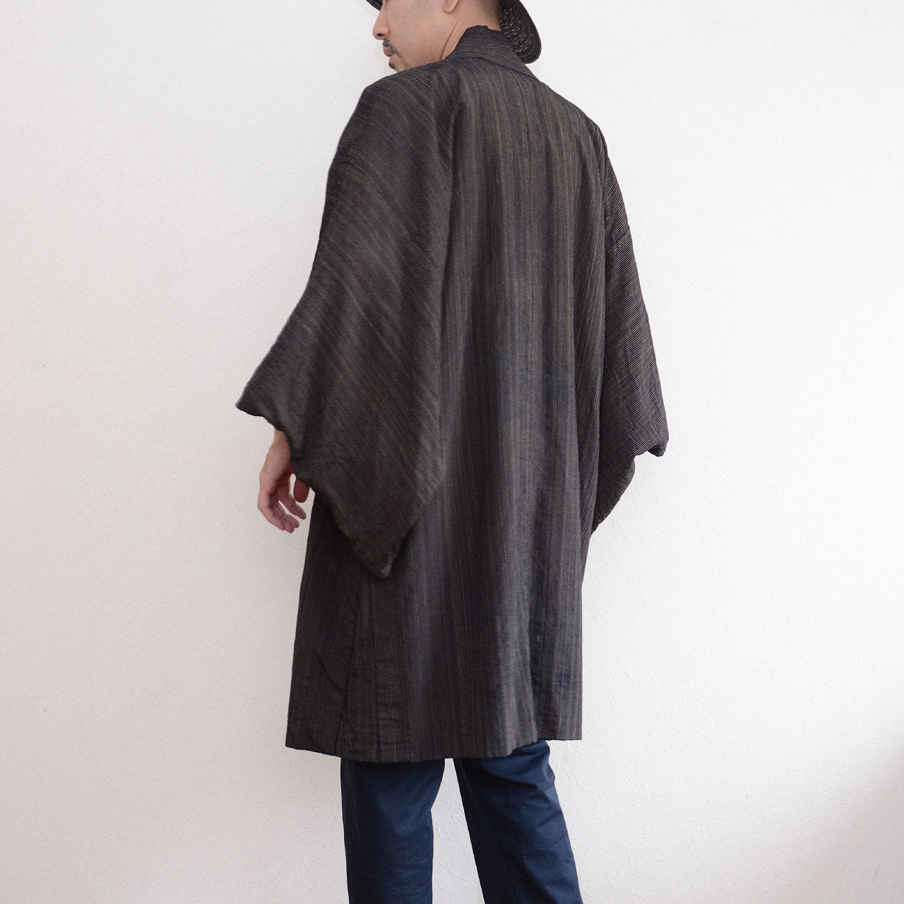 171 cm male model showing the back silhouette of a vintage indigo striped cotton haori