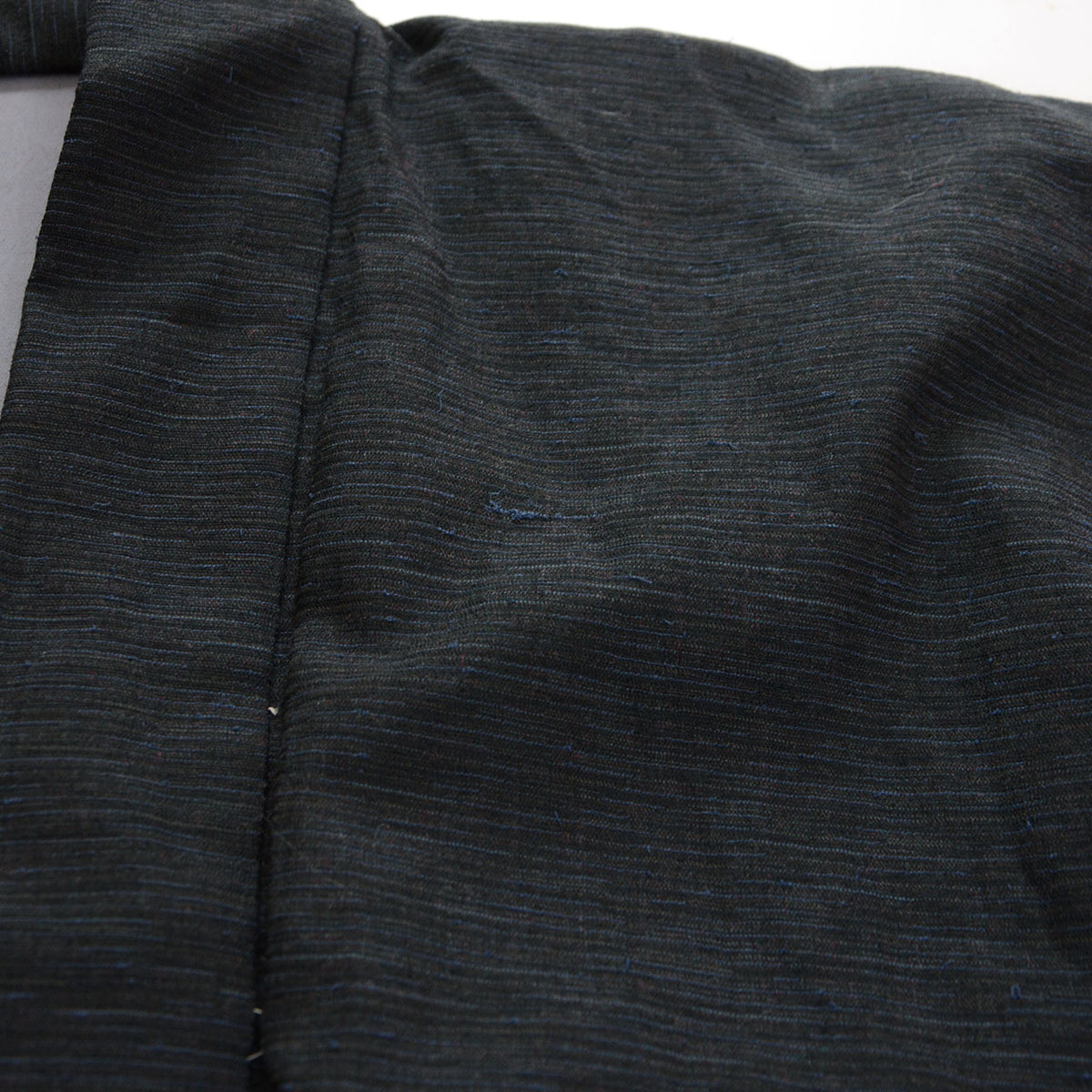 Fine slub weave of a men's vintage haori jacket with slight yarn slippage from production, 1970s-1980s Japan