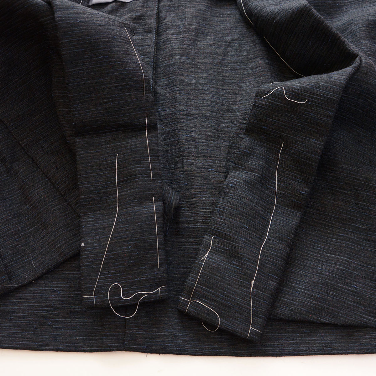 White basting threads remaining under the collar of a men's vintage haori jacket, 1970s-1980s Japan vintage