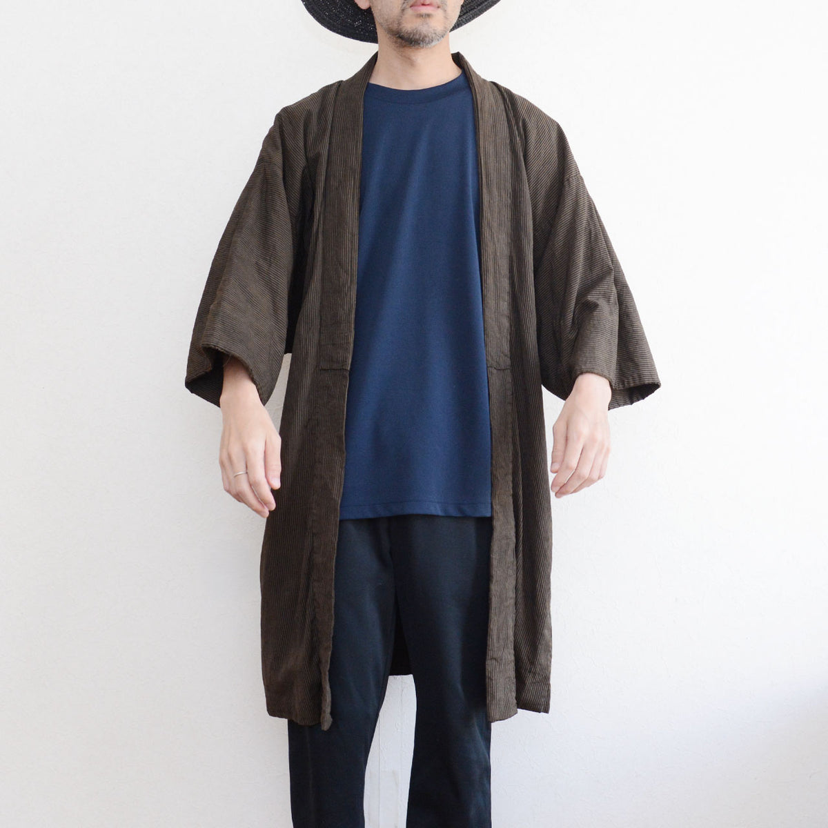 Japanese vintage men's haori jacket worn from the front, showing the striped cotton outer fabric