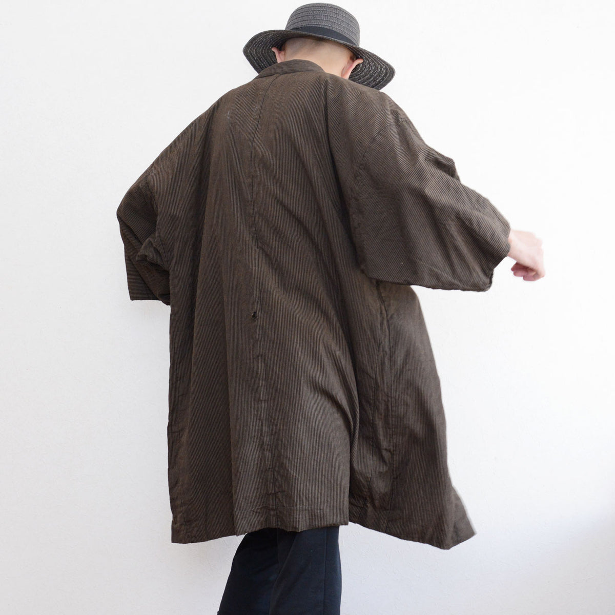 Japanese vintage men's haori jacket worn from the back, showing the long silhouette
