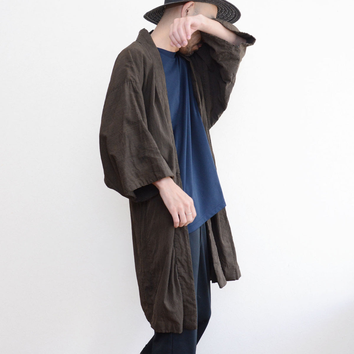 Japanese vintage men's haori jacket worn from the side, showing the generous sleeves