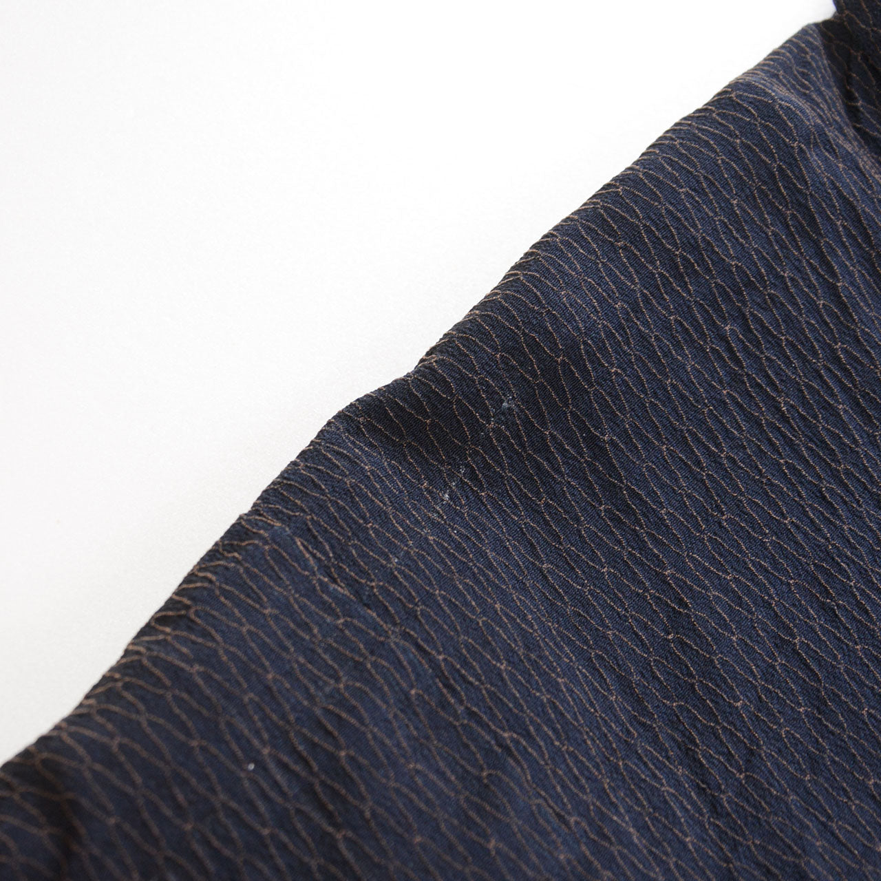 Close-up of the sleeve outer fabric of a deep navy Japanese vintage haori kimono jacket with fine raised texture