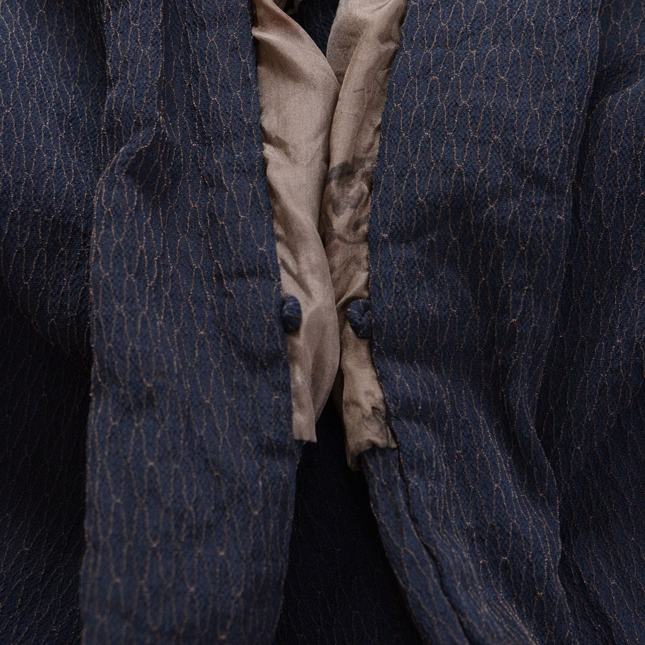 Front opening of a deep navy Japanese vintage haori kimono jacket showing the inner loops for a haori cord