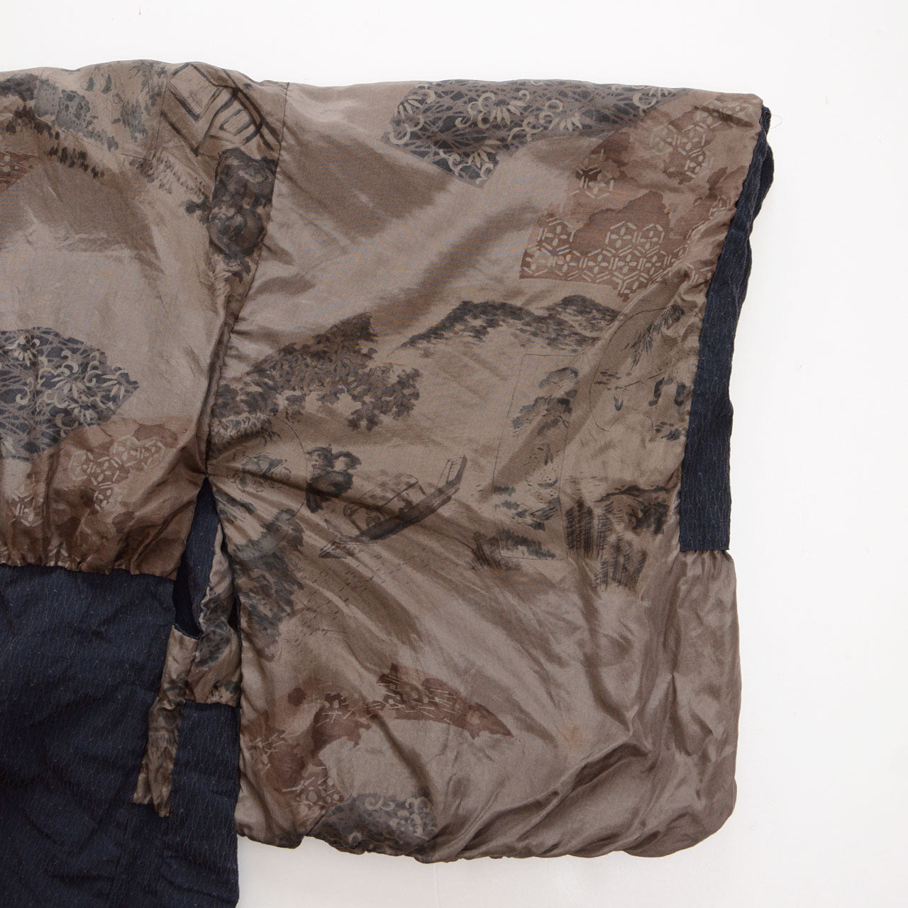 Close-up of the sleeve lining of a Japanese vintage haori kimono jacket with traditional landscape imagery