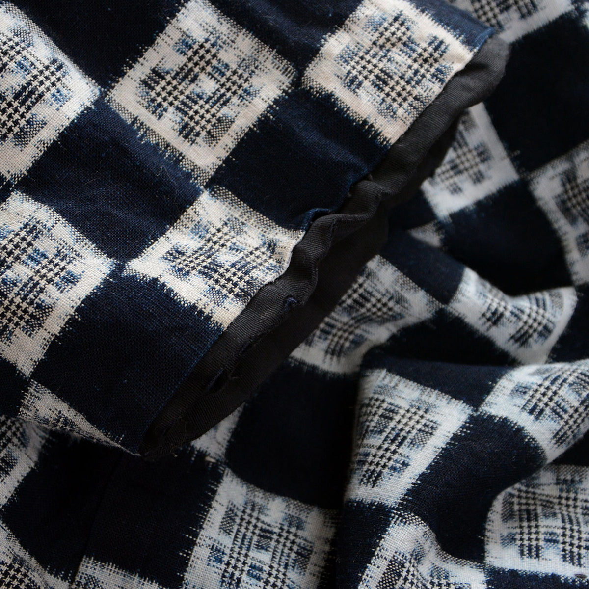Indigo cotton kasuri hanten sleeve edge with dark binding and visible damage