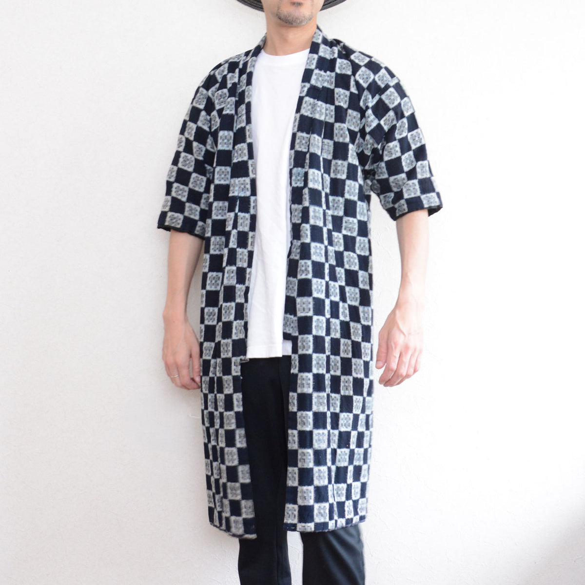 Long indigo kasuri padded hanten on a 171 cm adult model showing the knee-length fit